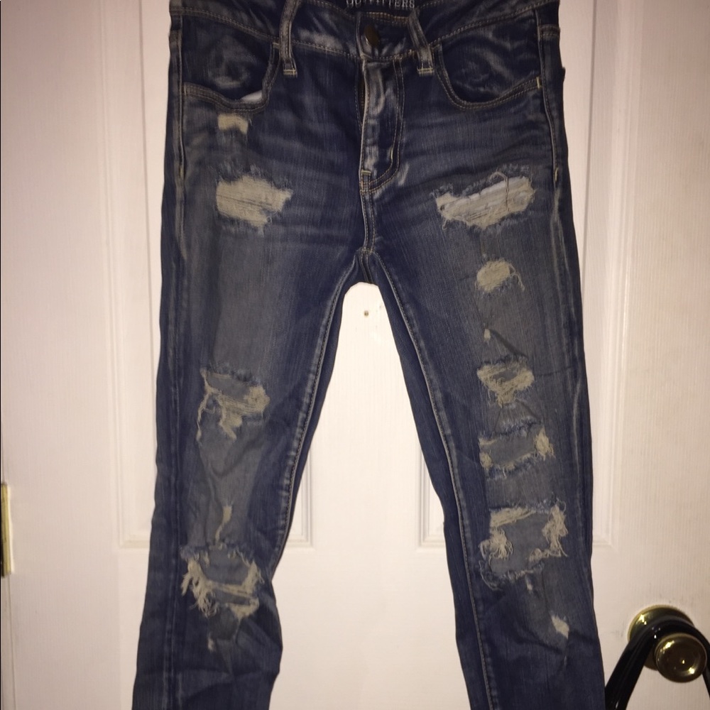 Dark wash distressed blue jeans